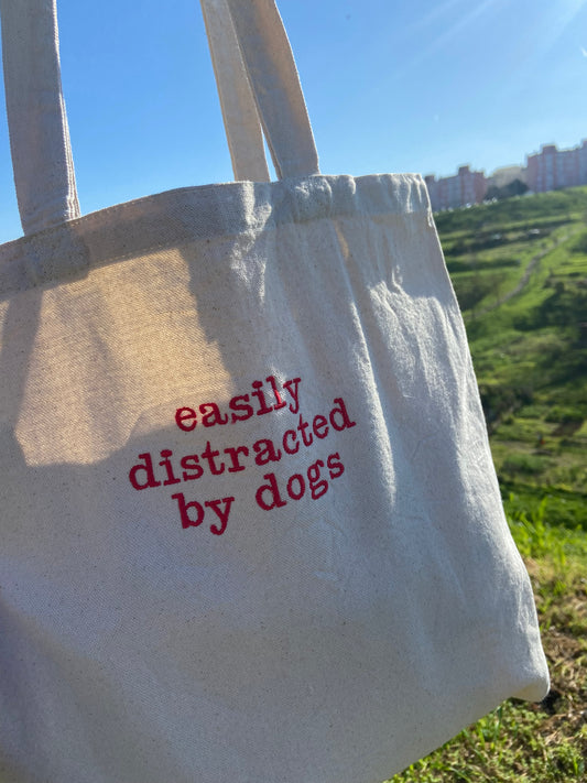 'Easily distracted by dogs' tote bag