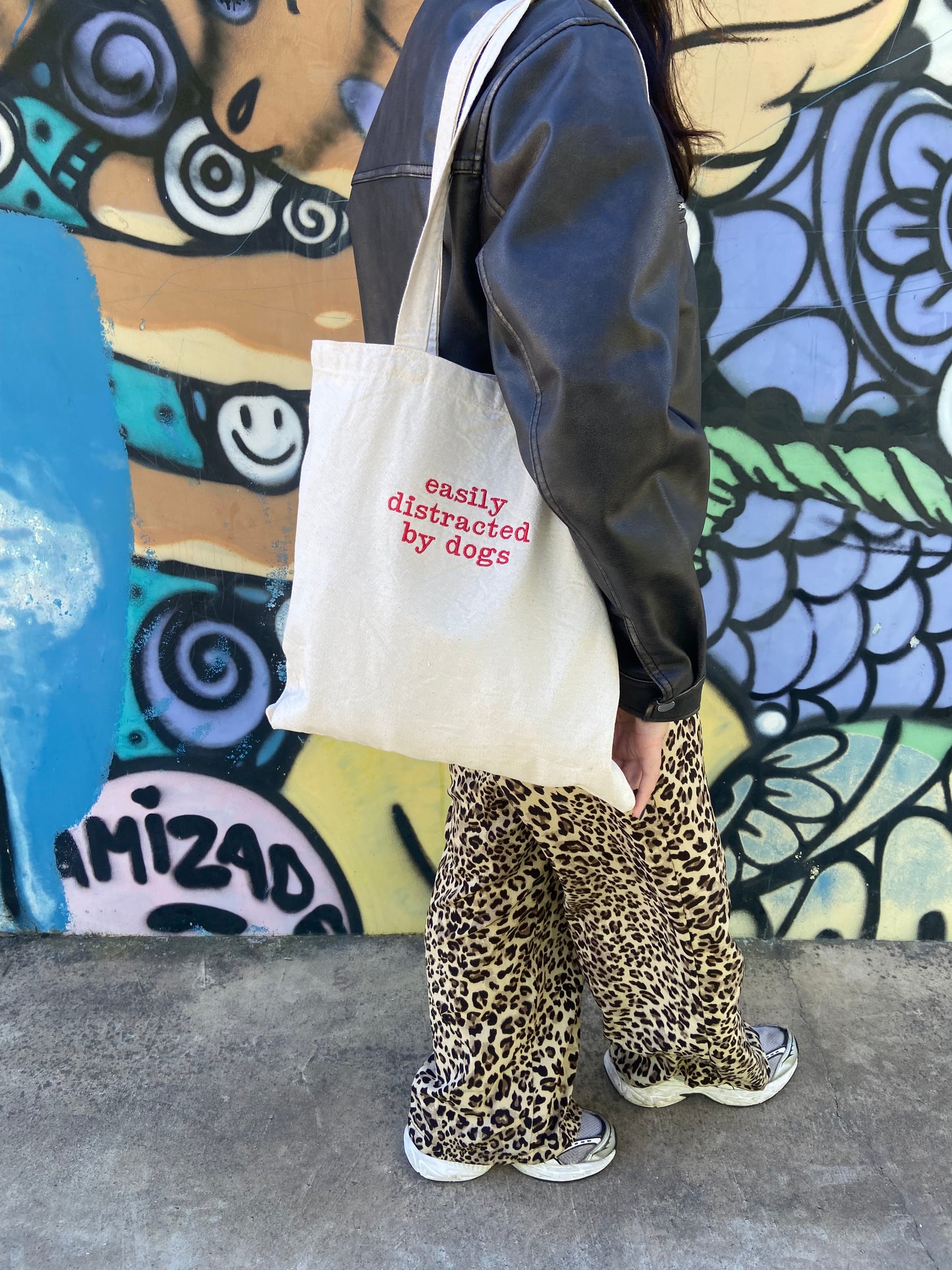 'Easily distracted by dogs' tote bag