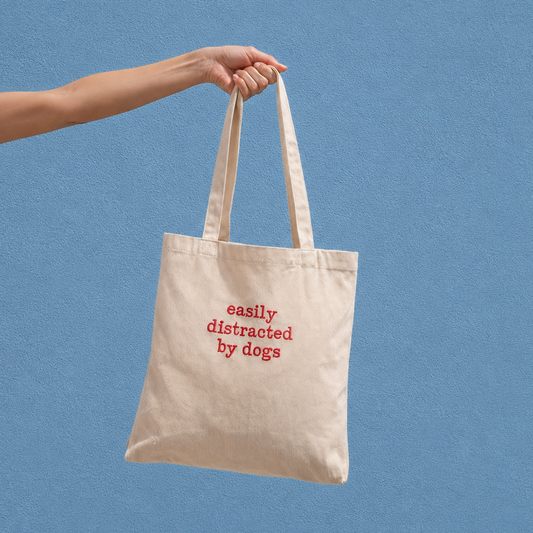 'Easily distracted by dogs' tote bag